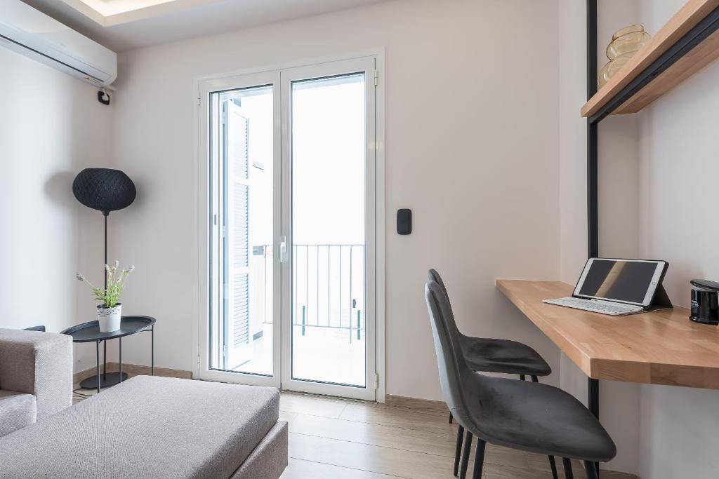 A television and/or entertainment centre at Petraki Residence 1bdr Apt with balcony 1 min from Ermou str