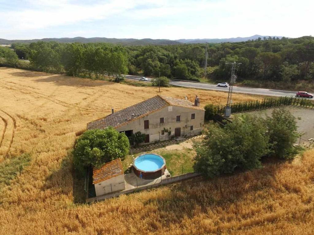 an aerial view of a house with a swimming pool at Can Jep Llarg Casa Rural in Cassà de la Selva