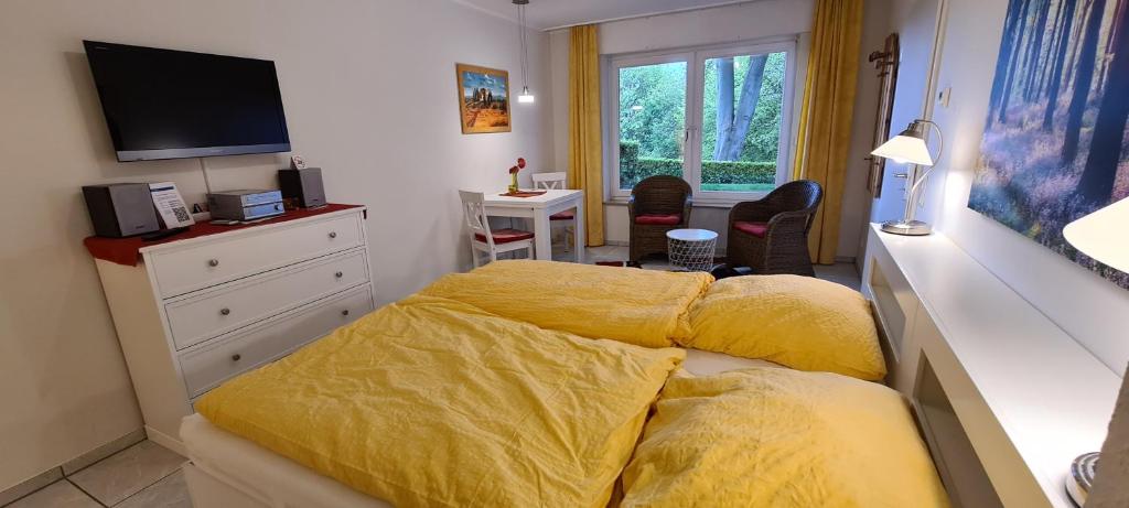 Postel nebo postele na pokoji v ubytování Ferienwohnung "Tecklenburger Augenblicke"