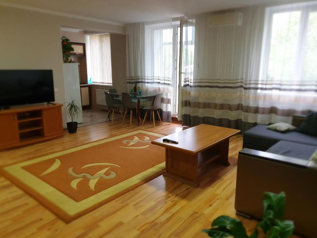 a living room with a couch and a table at Аpartments on the main street in Bălţi