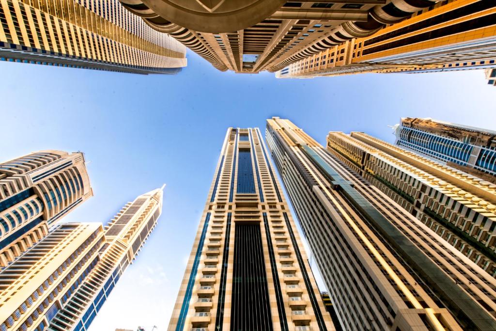 a tall building looking up into the sky at Studios for Female in Dubai, Marina in Dubai