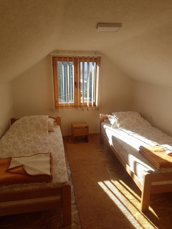 Postel nebo postele na pokoji v ubytování Zlatar duplex