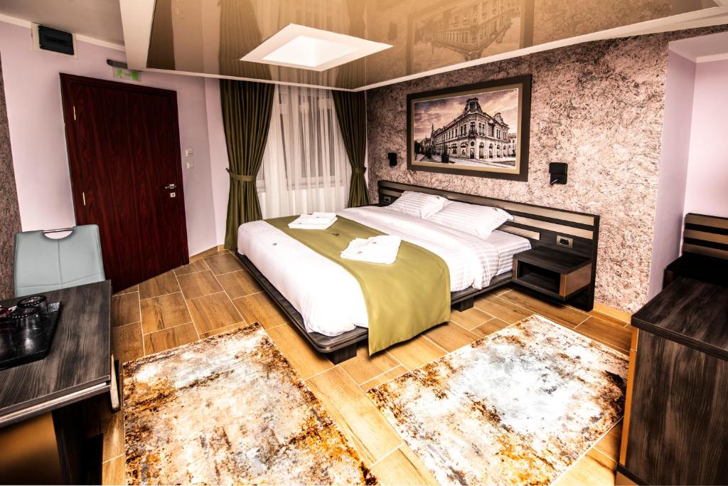 Postel nebo postele na pokoji v ubytování Hotel Novotheos
