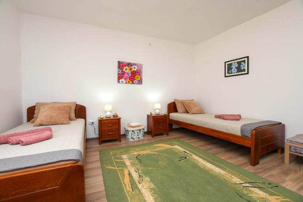 Postel nebo postele na pokoji v ubytování Oasis House