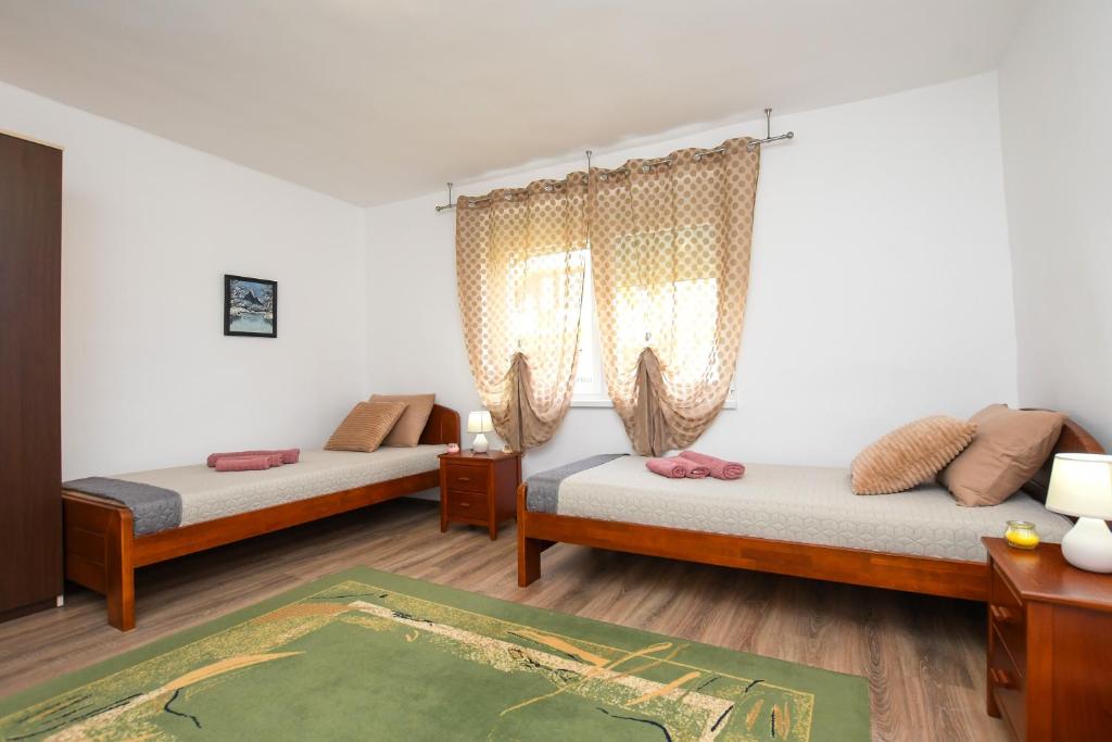 Postel nebo postele na pokoji v ubytování Oasis House