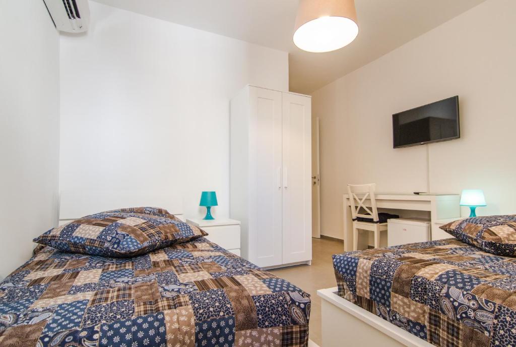 Postel nebo postele na pokoji v ubytování Casa Di Hilde