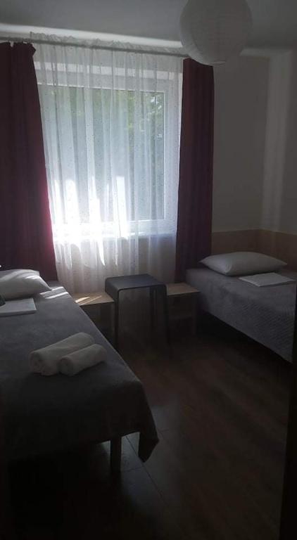 Postel nebo postele na pokoji v ubytování Vila Giruliai