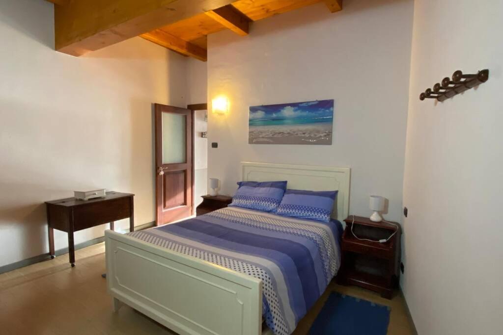 Ein Bett oder Betten in einem Zimmer der Unterkunft L’Angolo di Laura