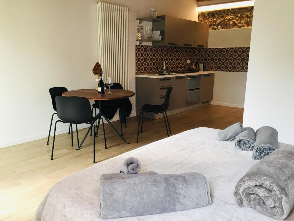 Łóżko lub łóżka w pokoju w obiekcie UnicumHouse Verona