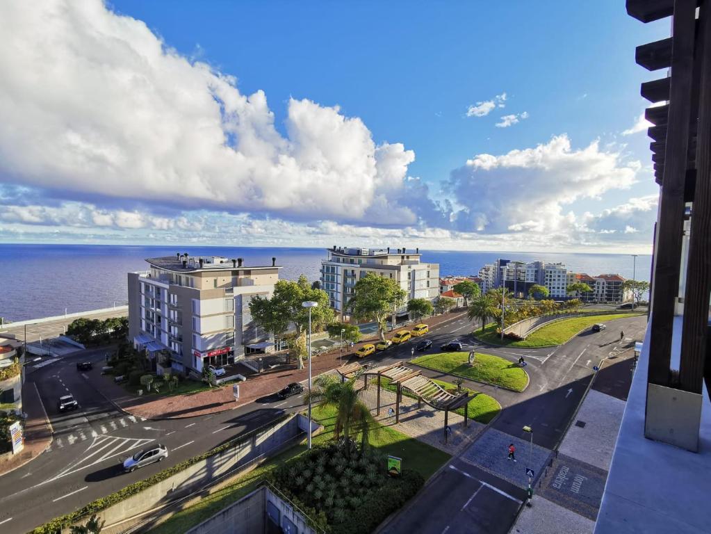 a view of the ocean from a building at Sun Island Apartments in Funchal