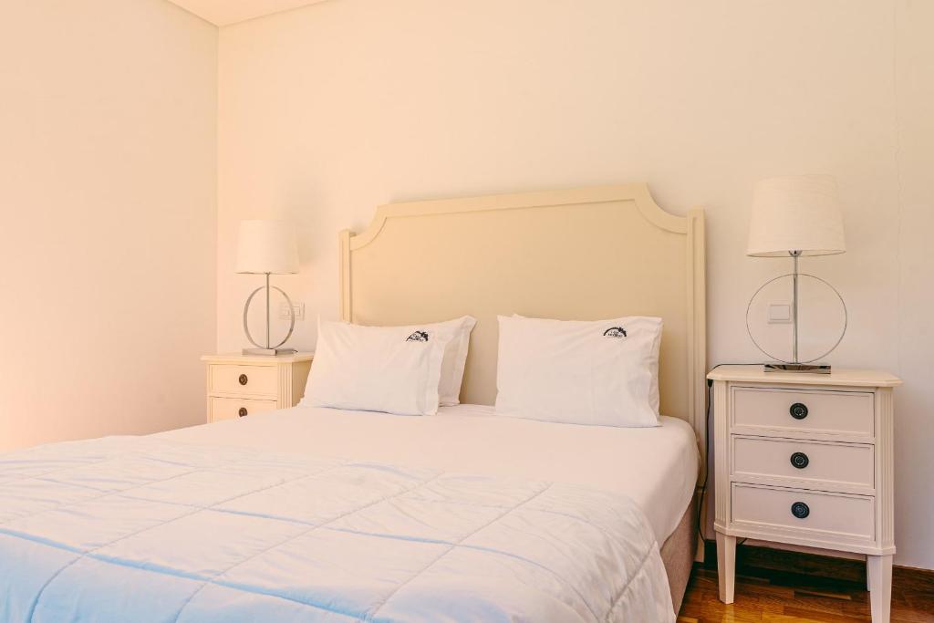 Postel nebo postele na pokoji v ubytování Casa das Mourôas