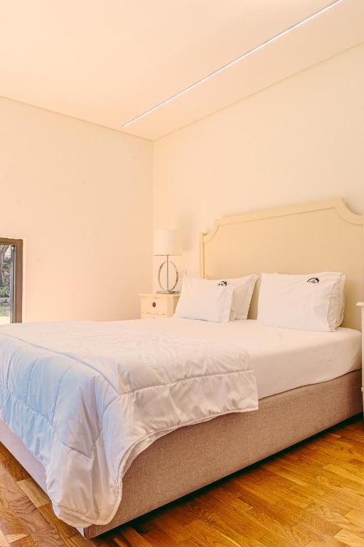 Postel nebo postele na pokoji v ubytování Casa das Mourôas