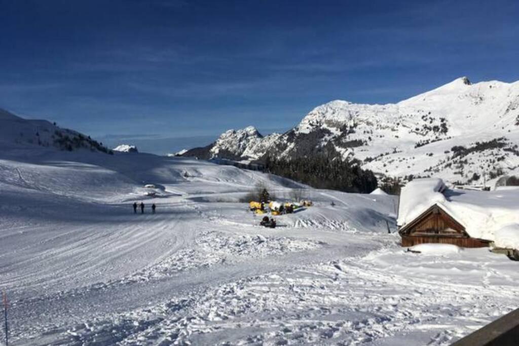 a snow covered cabin in the middle of a mountain at Chinaillon Gd Bo vue panoramique - appart 5 pers in Le Grand-Bornand