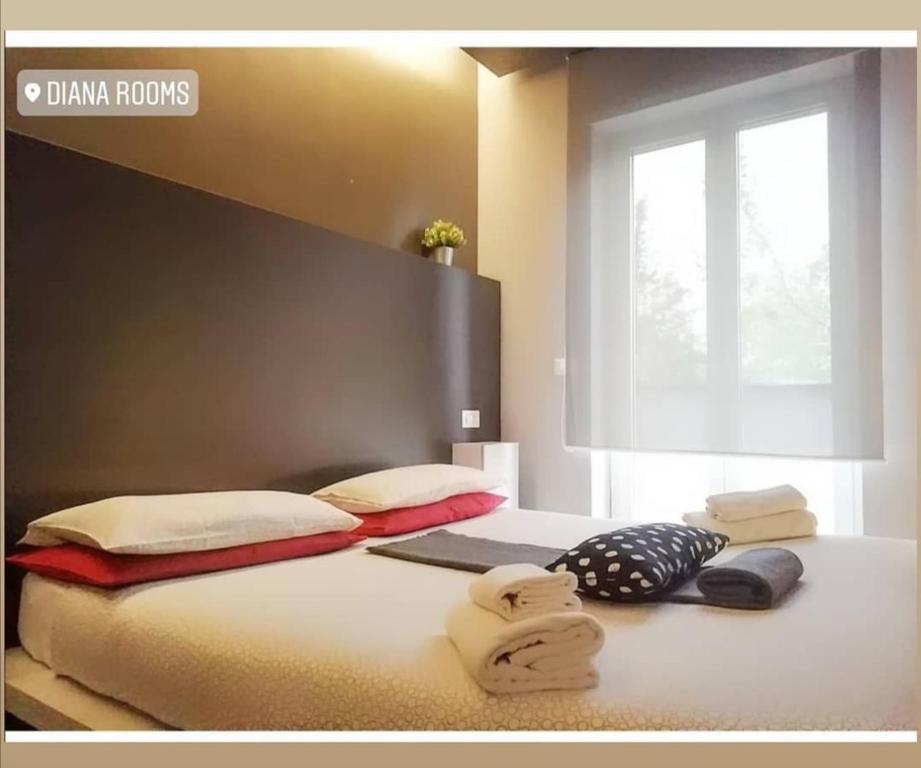 Cama ou camas em um quarto em Diana Rooms