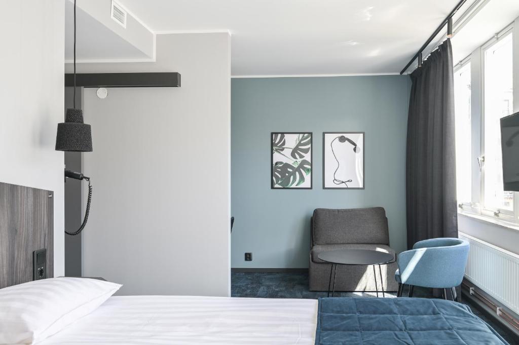 Postel nebo postele na pokoji v ubytování Hotel Fridhem