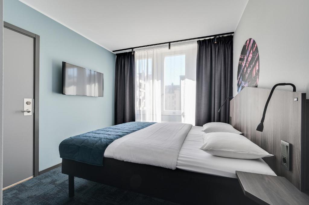 Postel nebo postele na pokoji v ubytování Hotel Fridhem