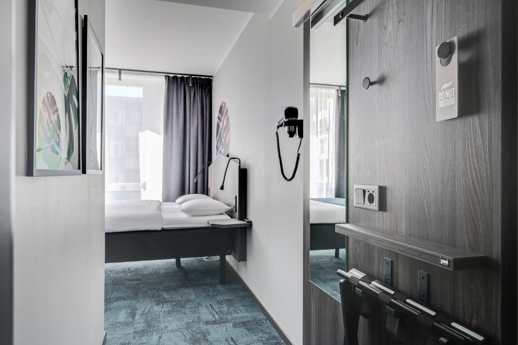 Postel nebo postele na pokoji v ubytování Hotel Fridhem