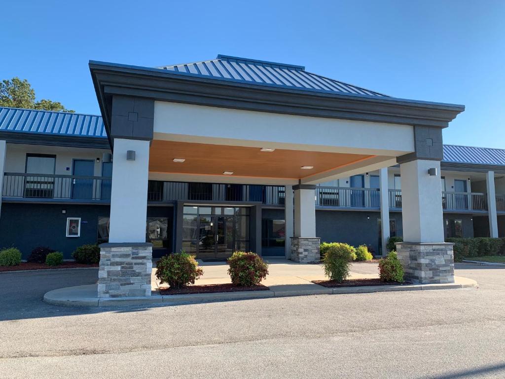 a large building with a large garage at Best Western Emporia in Emporia