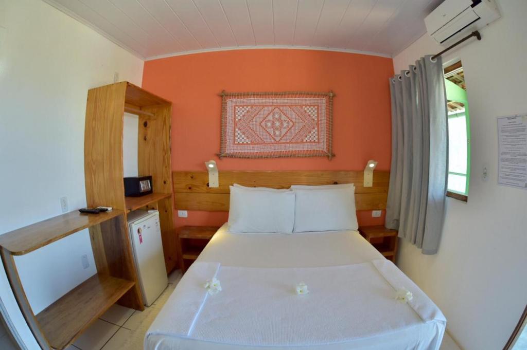 Un pat sau paturi într-o cameră la Pousada Praia Bonita Em Milagres