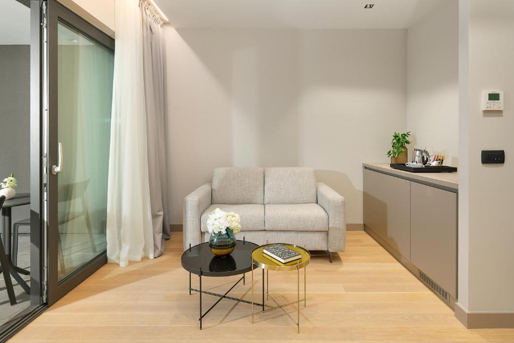 a living room with a couch and a table at Boutique Hotel Porto in Dubrovnik