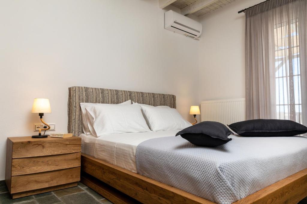 A bed or beds in a room at Naxian Icon Luxury Residence