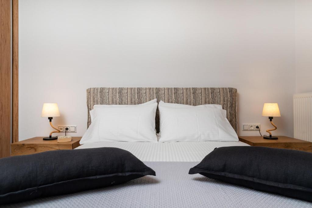 A bed or beds in a room at Naxian Icon Luxury Residence