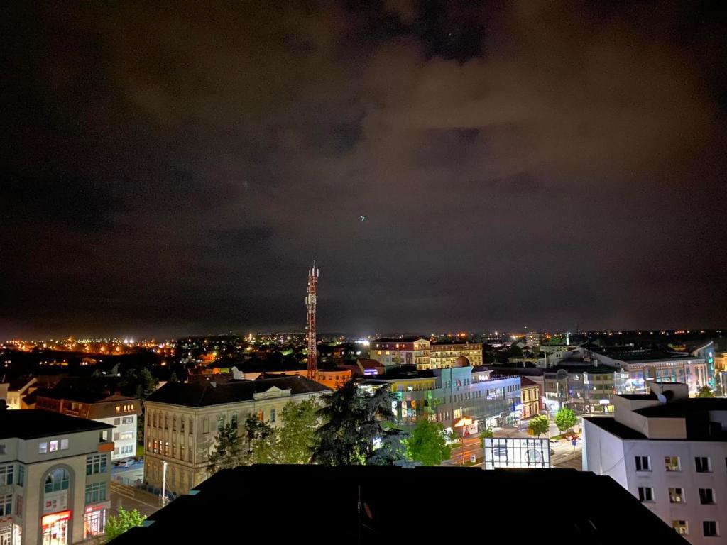 a view of a city at night at Kula Apartman in Brčko