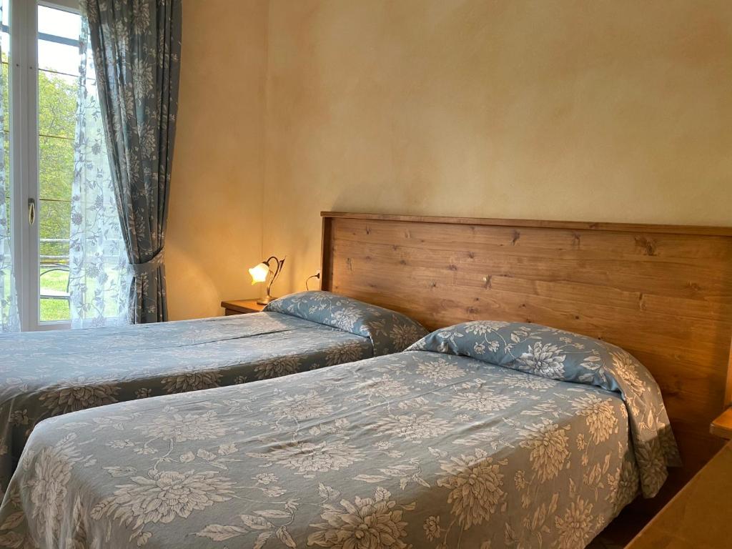 Postel nebo postele na pokoji v ubytování Garni Viggiona