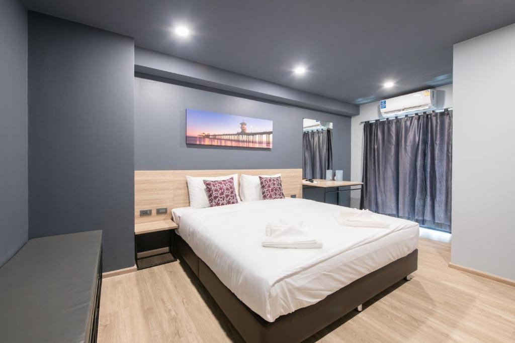 Ένα ή περισσότερα κρεβάτια σε δωμάτιο στο Oblique Apartment - ออฟบลิค อพาร์ทเมนท์