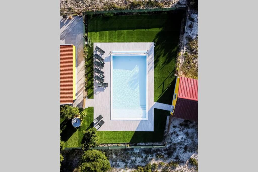 an aerial view of a yard with a swimming pool at Quinta do Pica-Pau Amarelo in Grândola