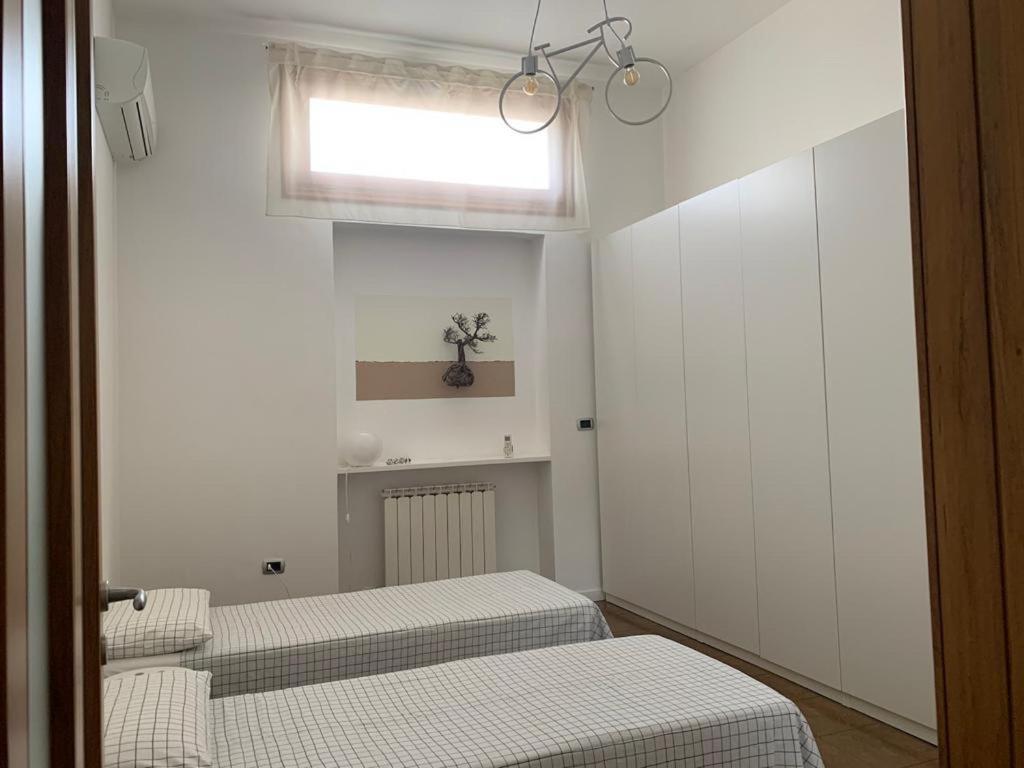 Posteľ alebo postele v izbe v ubytovaní L’Avamposto di Otranto