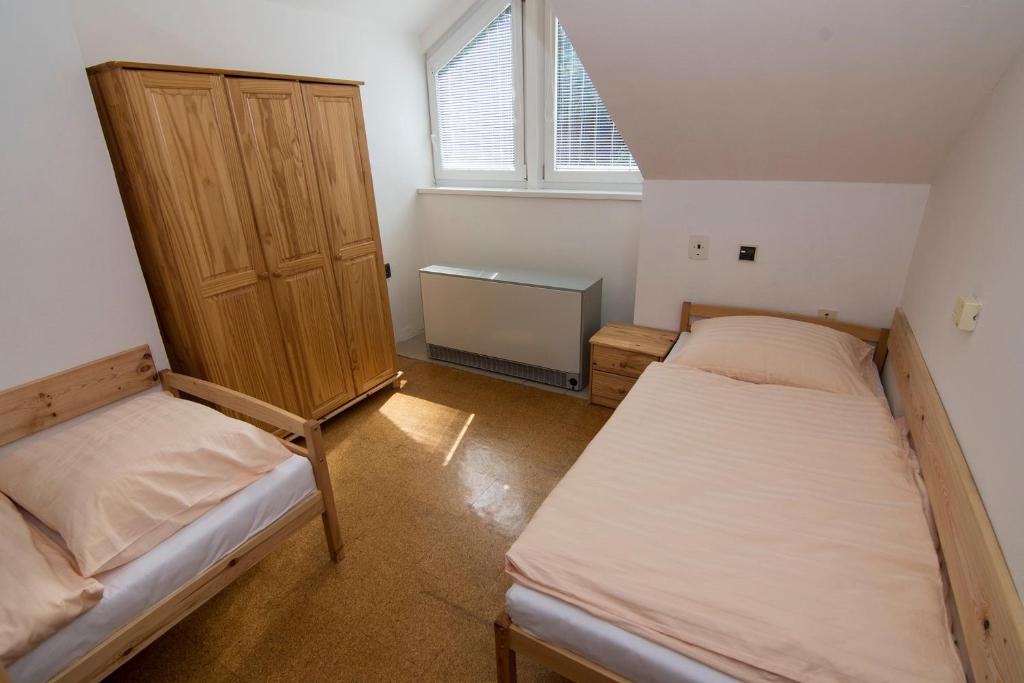 Postel nebo postele na pokoji v ubytování Apartmán Lorien Nekoř