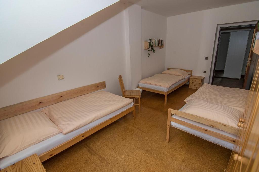 Postel nebo postele na pokoji v ubytování Apartmán Lorien Nekoř