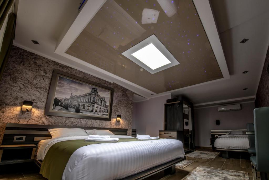 Postel nebo postele na pokoji v ubytování Hotel Novotheos