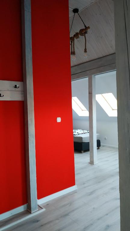 Posteľ alebo postele v izbe v ubytovaní Apartament Witkacego Czerwony