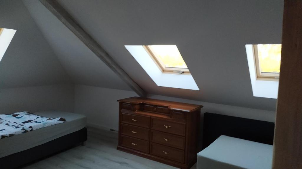 Posteľ alebo postele v izbe v ubytovaní Apartament Witkacego Czerwony