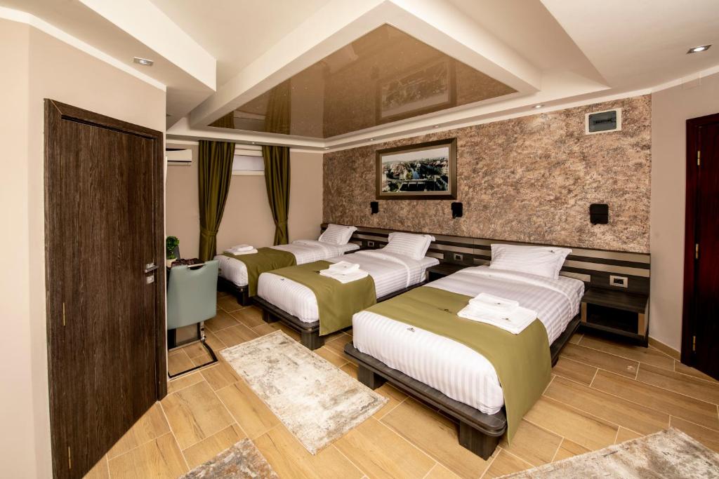 Postel nebo postele na pokoji v ubytování Hotel Novotheos