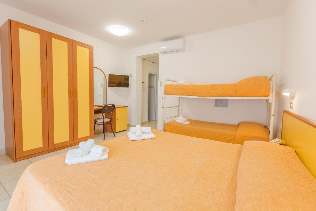 Postel nebo postele na pokoji v ubytování Hotel Marylise