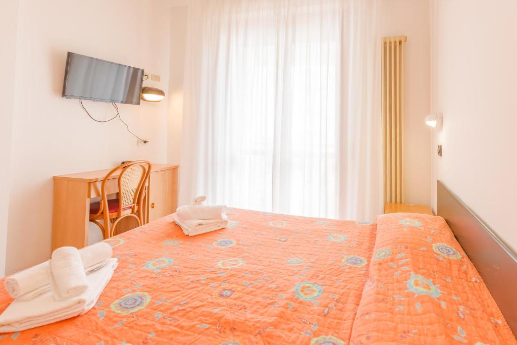 Postel nebo postele na pokoji v ubytování Hotel Marylise
