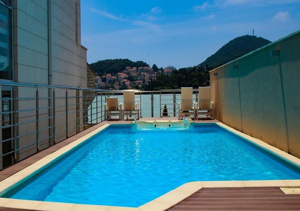 a swimming pool on the roof of a building at Berkeley Hotel & Day Spa in Dubrovnik