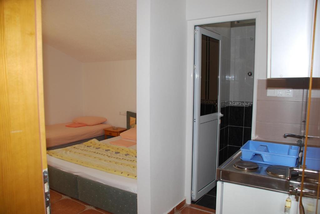Postel nebo postele na pokoji v ubytování Guest House Nura