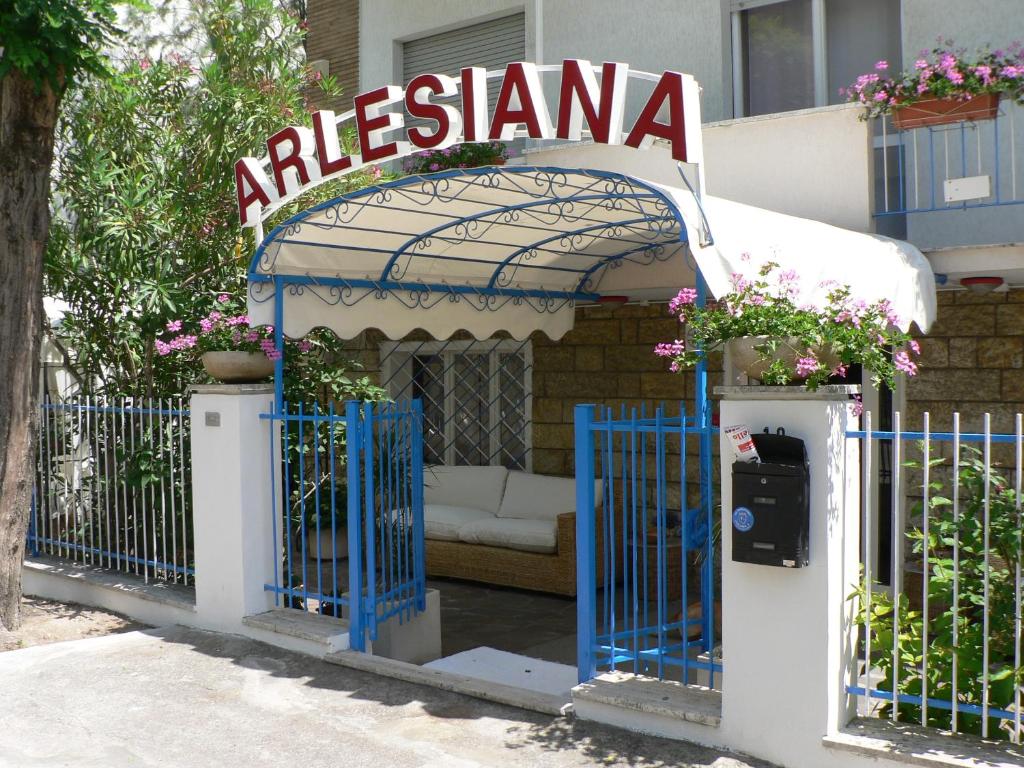 a gazebo with a sign on top of it at Hotel Arlesiana in Rimini