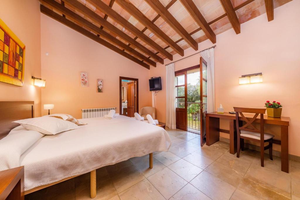Postel nebo postele na pokoji v ubytování Villa Ribot