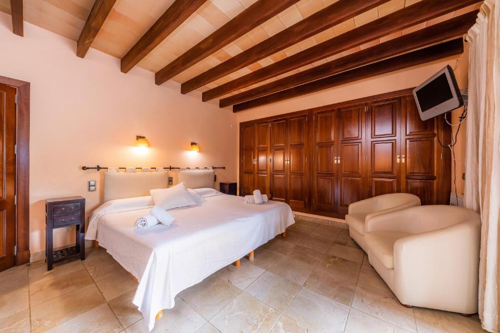 Postel nebo postele na pokoji v ubytování Villa Ribot
