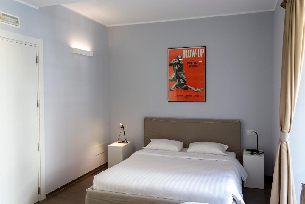 Posteľ alebo postele v izbe v ubytovaní L'Ottava GuestHouse
