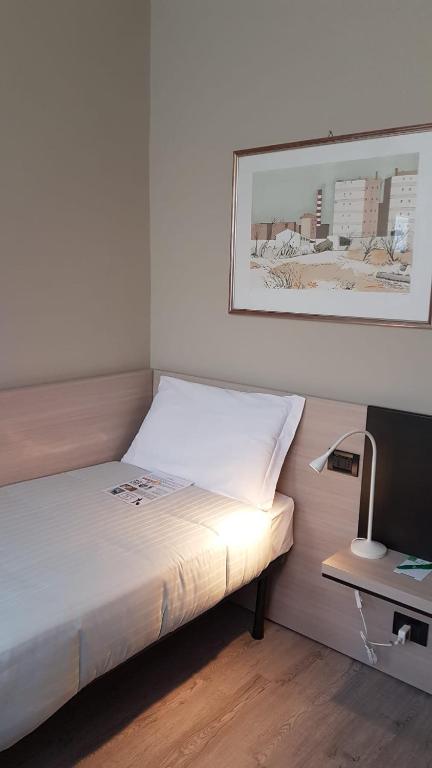 Postel nebo postele na pokoji v ubytování Hotel Gran Torino