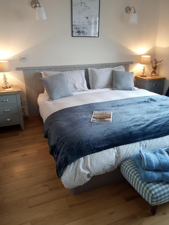 Postel nebo postele na pokoji v ubytování Clifden Bay Lodge