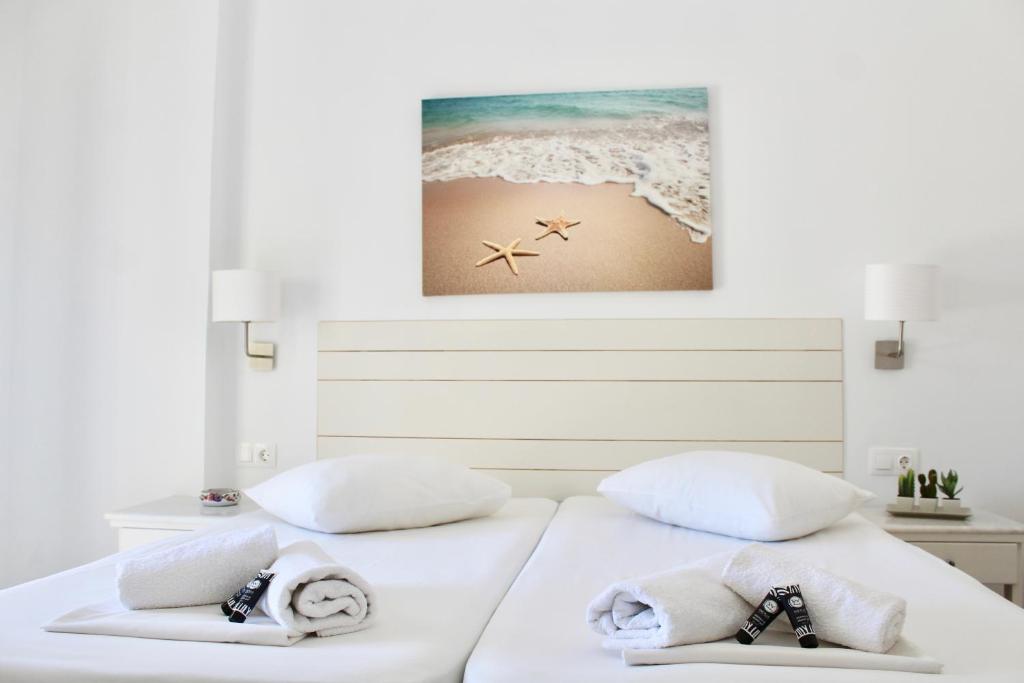 Cama ou camas em um quarto em Aegeo Inn