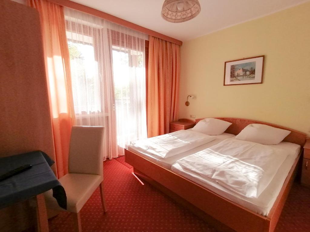 Postel nebo postele na pokoji v ubytování Strandpension Liane