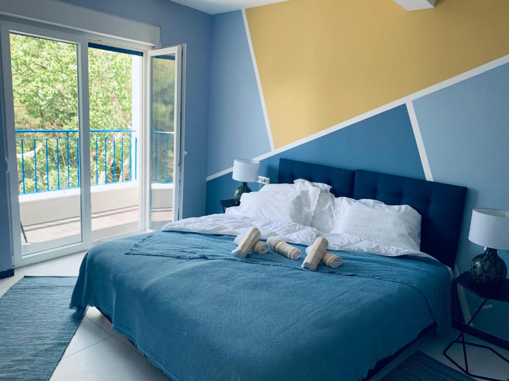 Posteľ alebo postele v izbe v ubytovaní Hotel Elu Iris